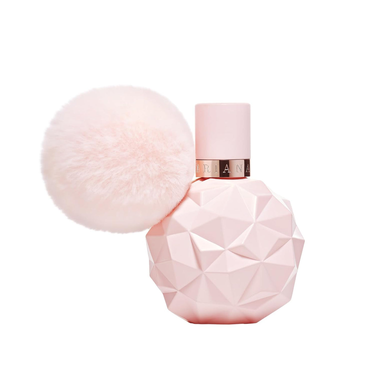 Pink perfume bottle with geometric design on a white background