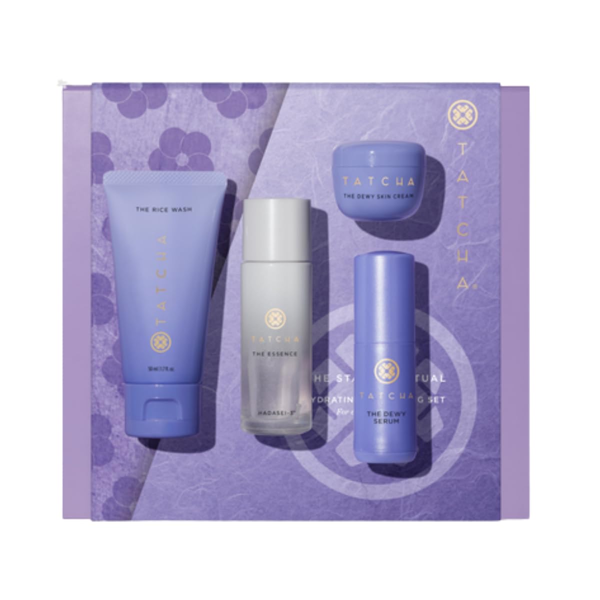 Tatcha skincare product set on a purple floral background