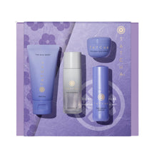 Tatcha skincare product set on a purple floral background