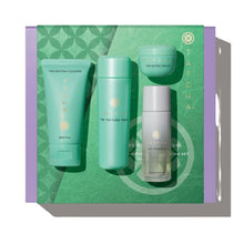 Tatcha skincare product set on a green and purple background