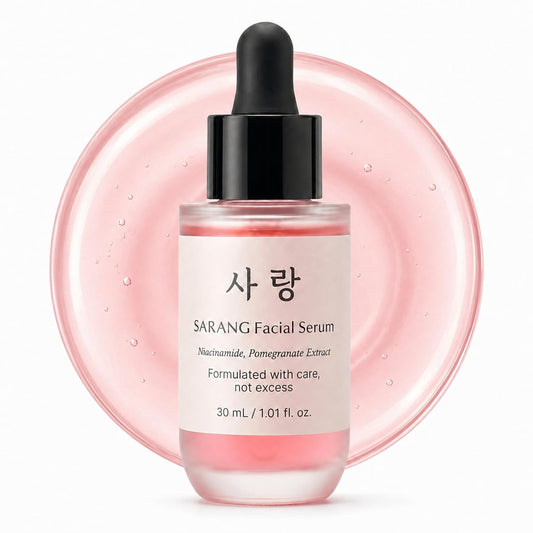 SARANG Facial Serum bottle with dropper on a pink circular background