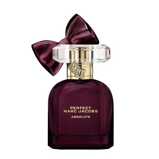 Marc Jacobs Perfect Absolute perfume bottle with a large purple bow on a white background