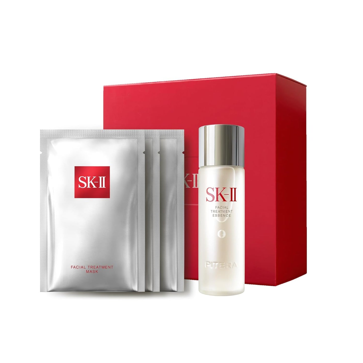 SK-II skincare set with facial treatment mask and essence bottle on a white background