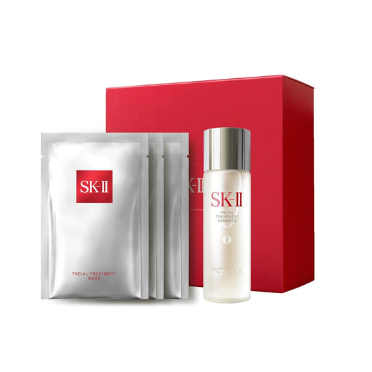 SK-II skincare set with facial treatment mask and essence bottle on a white background
