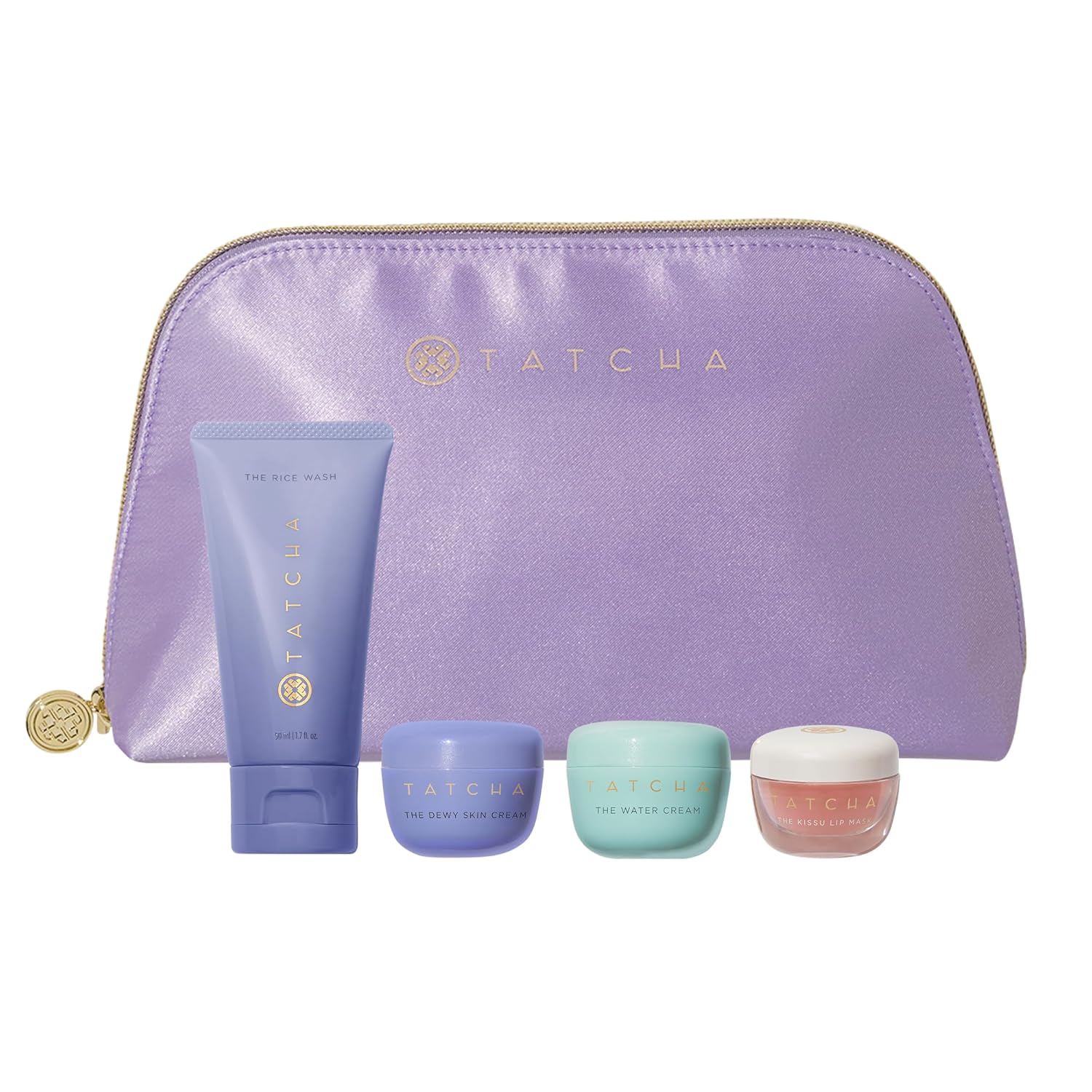 Tatcha skincare product set with a purple pouch on a white background