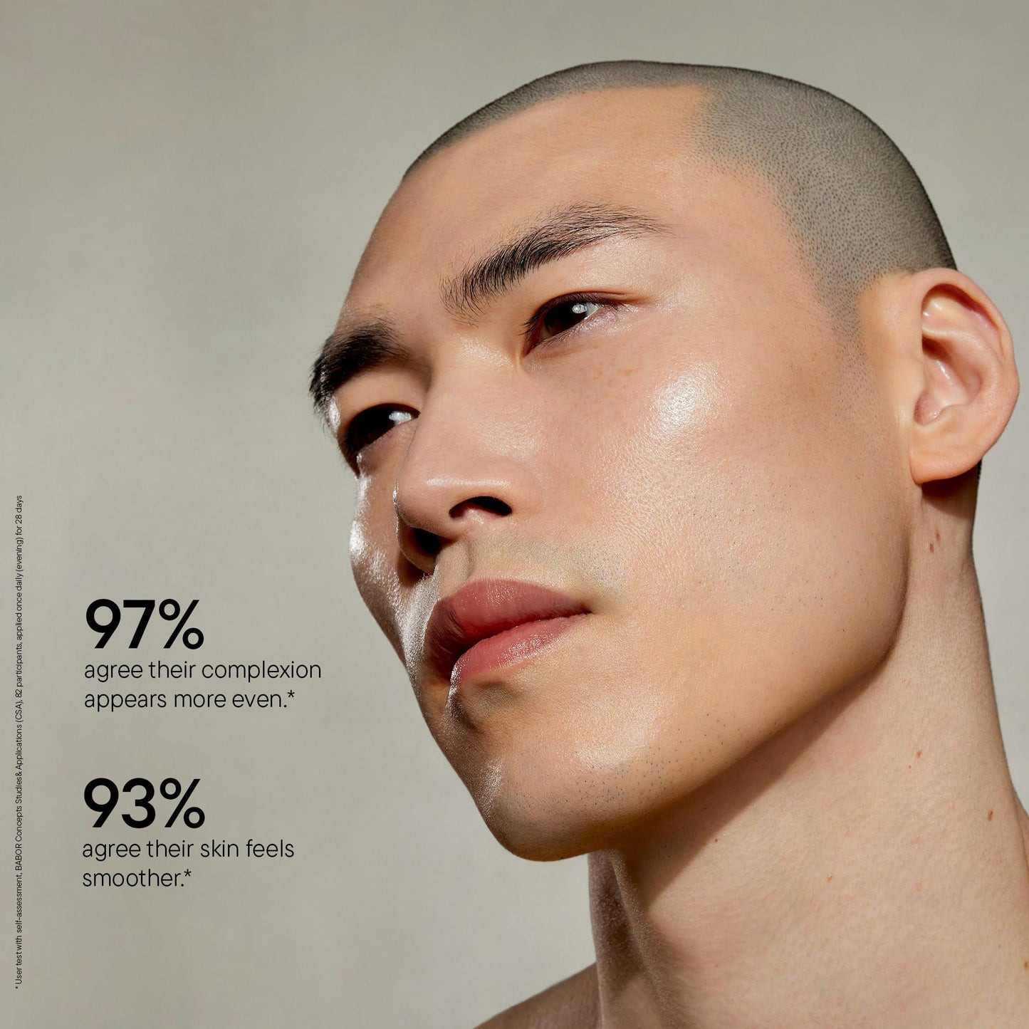 Close-up of a person with even skin texture on a neutral background